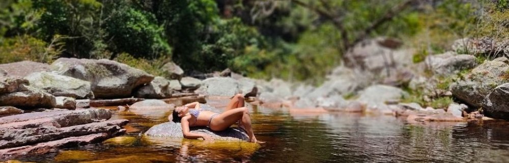 Rocky river bed leading to a waterfall